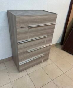 The Warner Chest of 5-Drawers from Homecentre features a beige and caramel walnut finish with distinct long metallic handles.