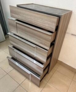 The Warner Chest of 5-Drawers from Homecentre features a beige and caramel walnut finish with distinct long metallic handles. - Image 11