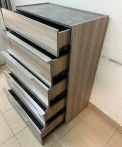 The Warner Chest of 5-Drawers from Homecentre features a beige and caramel walnut finish with distinct long metallic handles. - Image 13