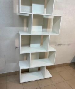 This white 5-tier geometric S-shaped bookshelf functions as an open display rack or room divider. - Image 12
