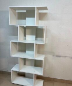 This white 5-tier geometric S-shaped bookshelf functions as an open display rack or room divider. - Image 4