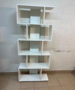 This white 5-tier geometric S-shaped bookshelf functions as an open display rack or room divider. - Image 3