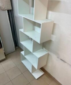 This white 5-tier geometric S-shaped bookshelf functions as an open display rack or room divider. - Image 5