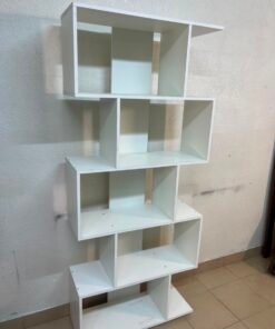 This white 5-tier geometric S-shaped bookshelf functions as an open display rack or room divider. - Image 14