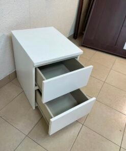 The IKEA MALM two-drawer chest of drawers in white is typically used as a bedside table or small storage unit. - Image 12