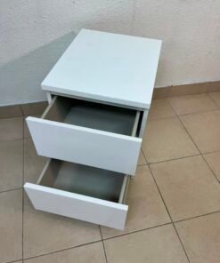 The IKEA MALM two-drawer chest of drawers in white is typically used as a bedside table or small storage unit. - Image 11
