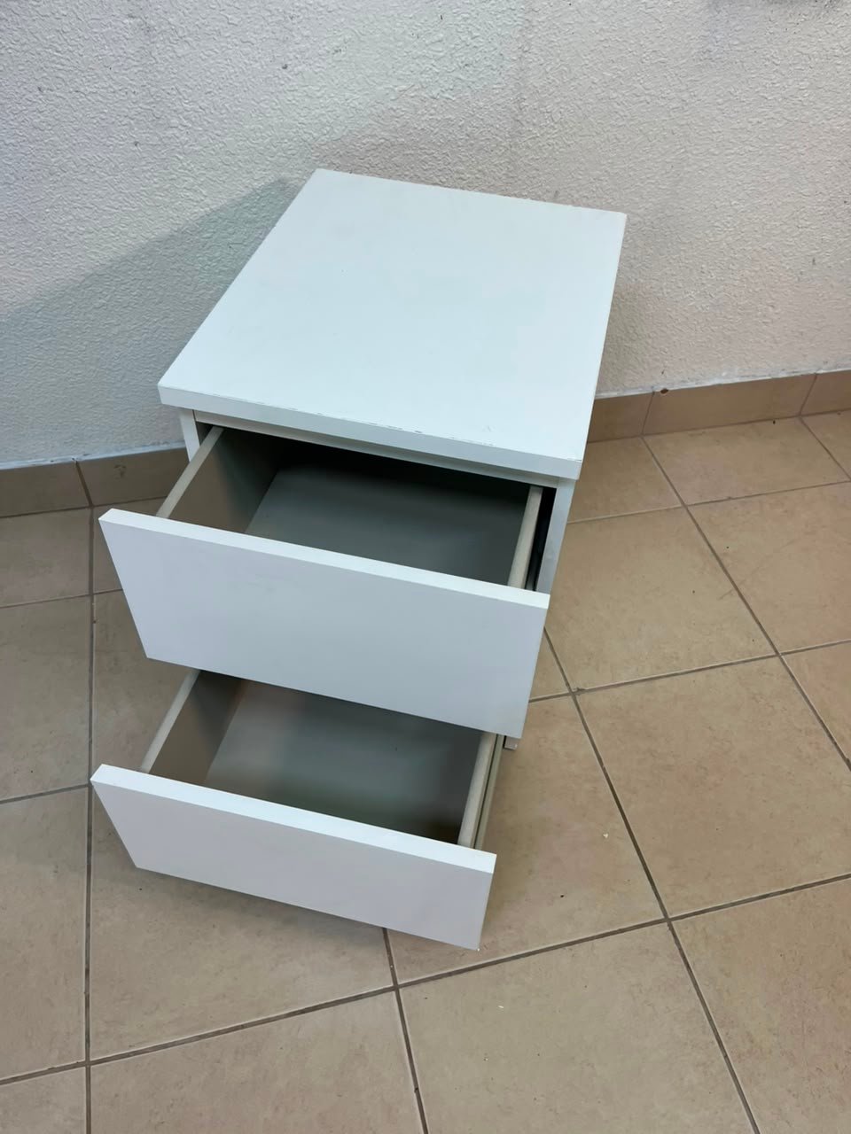 The IKEA MALM two-drawer chest of drawers in white is typically used as a bedside table or small storage unit. - Image 11