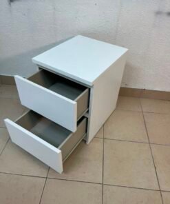 The IKEA MALM two-drawer chest of drawers in white is typically used as a bedside table or small storage unit. - Image 4