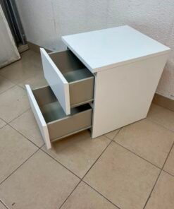 The IKEA MALM two-drawer chest of drawers in white is typically used as a bedside table or small storage unit. - Image 9