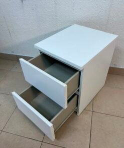 The IKEA MALM two-drawer chest of drawers in white is typically used as a bedside table or small storage unit. - Image 8