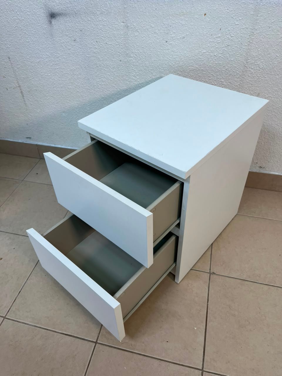 The IKEA MALM two-drawer chest of drawers in white is typically used as a bedside table or small storage unit. - Image 8
