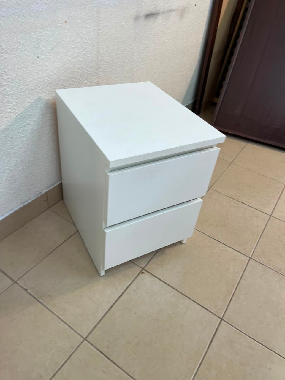 The IKEA MALM two-drawer chest of drawers in white is typically used as a bedside table or small storage unit. - Image 6