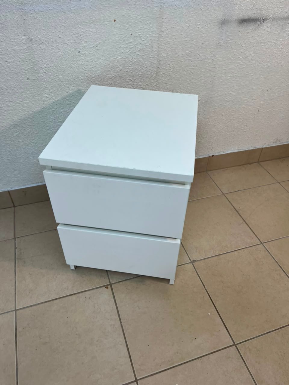 The IKEA MALM two-drawer chest of drawers in white is typically used as a bedside table or small storage unit. - Image 7