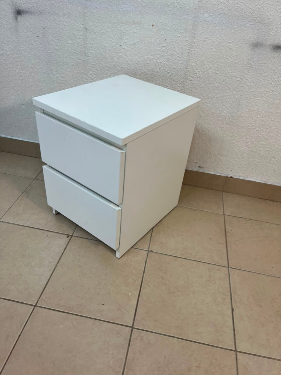 The IKEA MALM two-drawer chest of drawers in white is typically used as a bedside table or small storage unit. - Image 2
