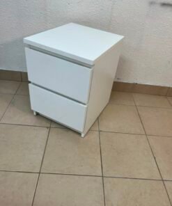 The IKEA MALM two-drawer chest of drawers in white is typically used as a bedside table or small storage unit.