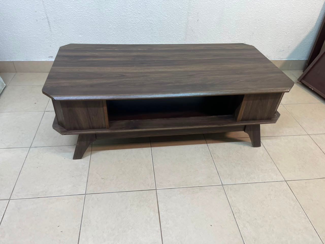 Tough-wearing walnut-finish wooden coffee table featuring a rectangular top, lower storage shelf, and subtle corner detailing. - Image 11