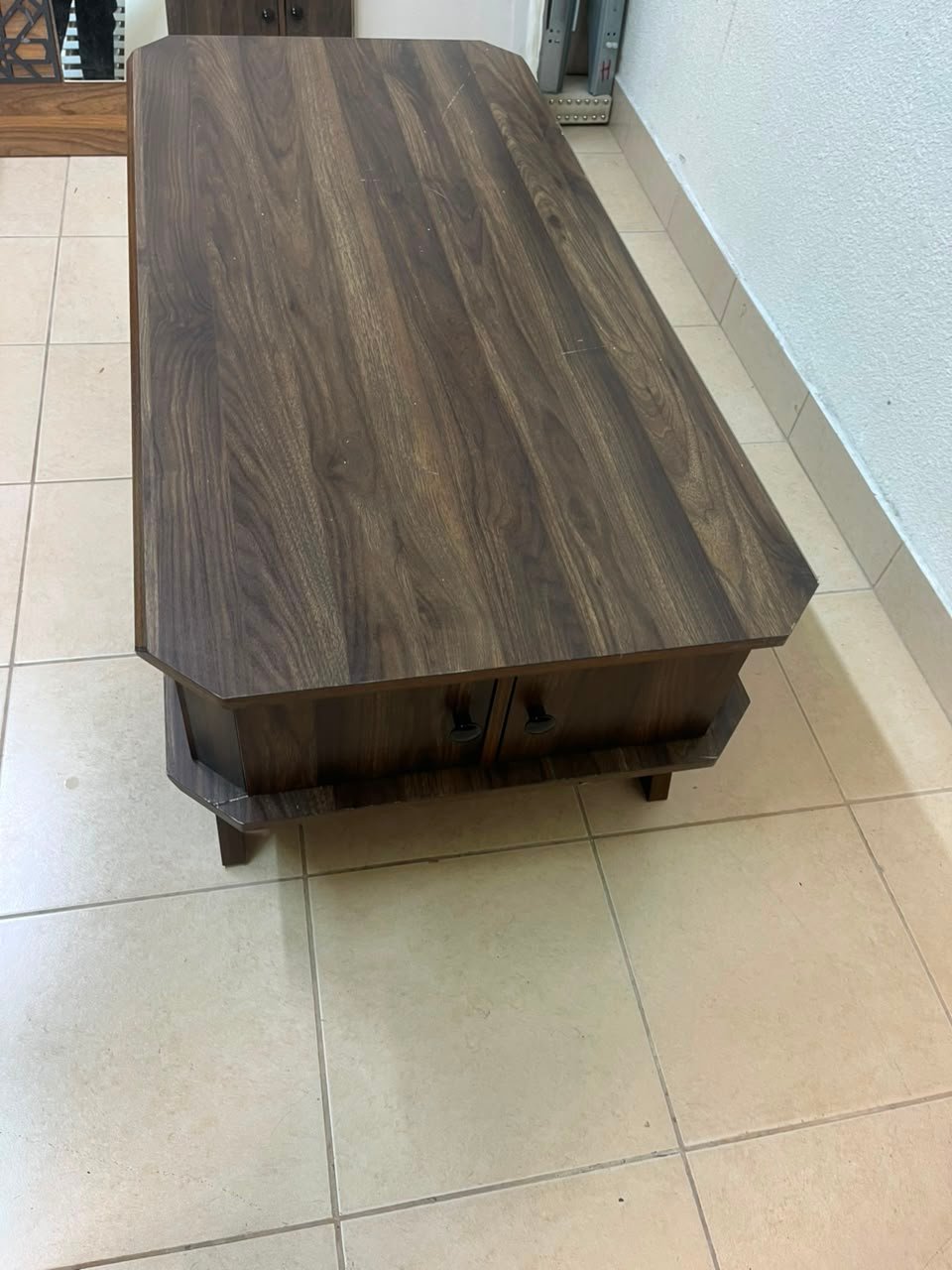 Tough-wearing walnut-finish wooden coffee table featuring a rectangular top, lower storage shelf, and subtle corner detailing. - Image 7