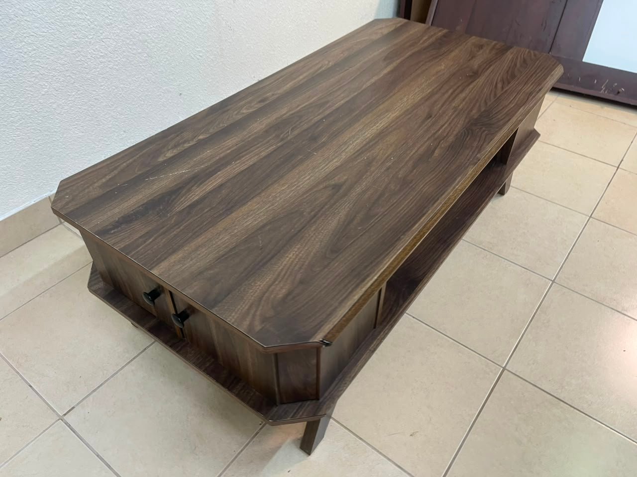 Tough-wearing walnut-finish wooden coffee table featuring a rectangular top, lower storage shelf, and subtle corner detailing. - Image 9