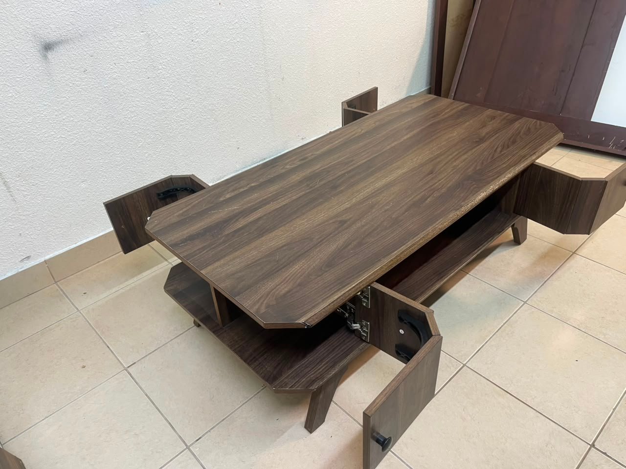 Tough-wearing walnut-finish wooden coffee table featuring a rectangular top, lower storage shelf, and subtle corner detailing. - Image 4