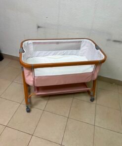 Portable Baby Bassinet / Co-Sleeper Crib with Lockable Wheels – Pink Fabric, Mesh Side Panels, Wood-Tone Frame & Under-Bed Storage Shelf - Image 2