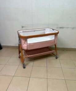 Portable Baby Bassinet / Co-Sleeper Crib with Lockable Wheels – Pink Fabric, Mesh Side Panels, Wood-Tone Frame & Under-Bed Storage Shelf - Image 3