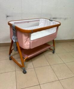Portable Baby Bassinet / Co-Sleeper Crib with Lockable Wheels – Pink Fabric, Mesh Side Panels, Wood-Tone Frame & Under-Bed Storage Shelf - Image 8