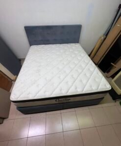 A modern, gray, upholstered double bed, paired with a thick, padded mattress with a soft top layer, featuring a prominent black border. - Image 2