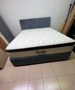 A modern, gray, upholstered double bed, paired with a thick, padded mattress with a soft top layer, featuring a prominent black border. - Image 4
