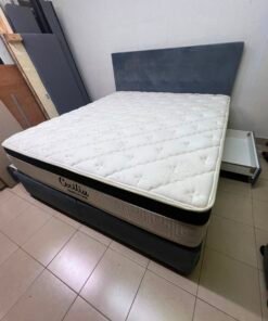A modern, gray, upholstered double bed, paired with a thick, padded mattress with a soft top layer, featuring a prominent black border. - Image 5