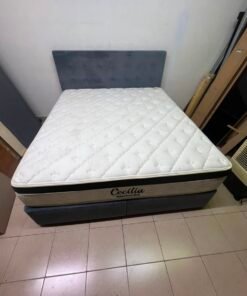 A modern, gray, upholstered double bed, paired with a thick, padded mattress with a soft top layer, featuring a prominent black border. - Image 6