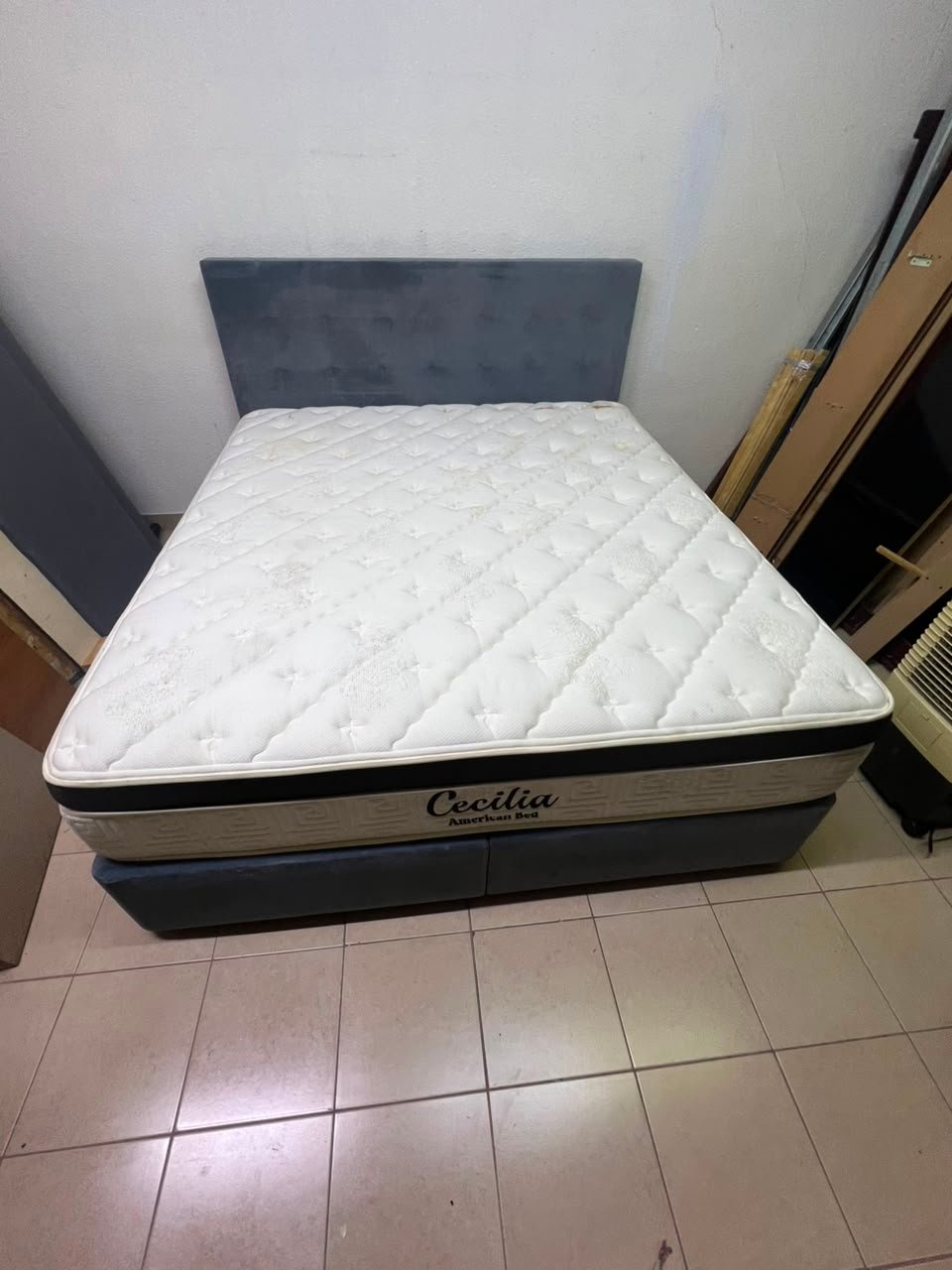 A modern, gray, upholstered double bed, paired with a thick, padded mattress with a soft top layer, featuring a prominent black border. - Image 6
