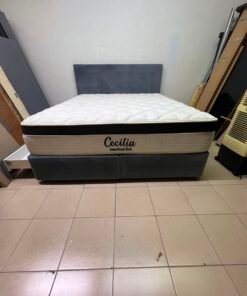 A modern, gray, upholstered double bed, paired with a thick, padded mattress with a soft top layer, featuring a prominent black border. - Image 7