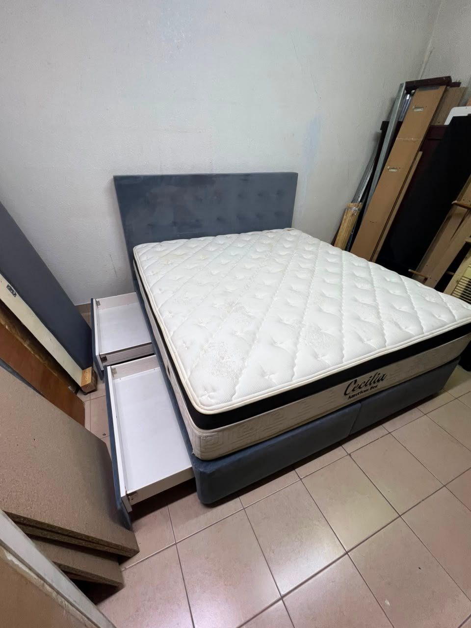 A modern, gray, upholstered double bed, paired with a thick, padded mattress with a soft top layer, featuring a prominent black border. - Image 8