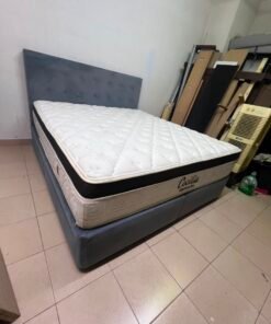 A modern, gray, upholstered double bed, paired with a thick, padded mattress with a soft top layer, featuring a prominent black border. - Image 9