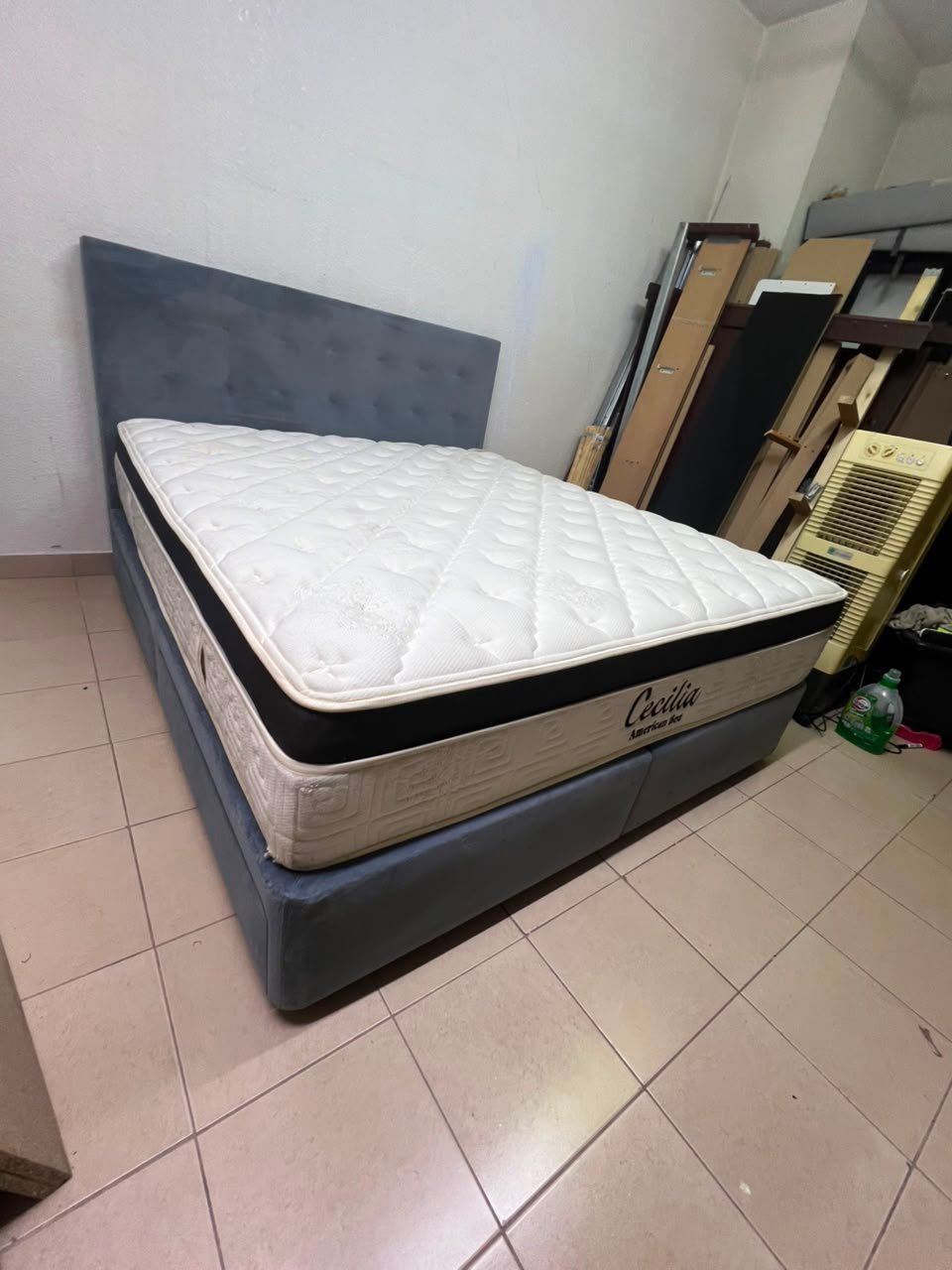 A modern, gray, upholstered double bed, paired with a thick, padded mattress with a soft top layer, featuring a prominent black border. - Image 9