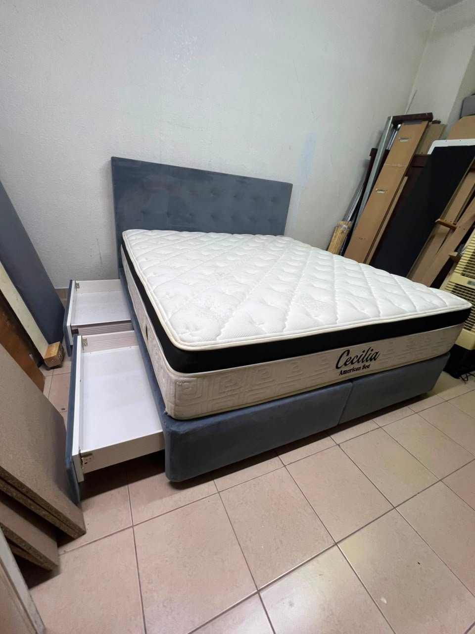 A modern, gray, upholstered double bed, paired with a thick, padded mattress with a soft top layer, featuring a prominent black border. - Image 10