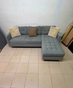 This is a three-seater corner sofa from IKEA in gray, featuring upholstered seat cushions and light-colored pointed wooden legs. - Image 2