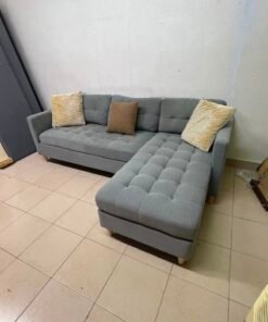 This is a three-seater corner sofa from IKEA in gray, featuring upholstered seat cushions and light-colored pointed wooden legs. - Image 3
