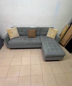 This is a three-seater corner sofa from IKEA in gray, featuring upholstered seat cushions and light-colored pointed wooden legs. - Image 4