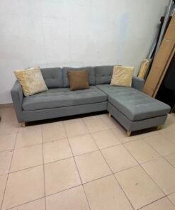 This is a three-seater corner sofa from IKEA in gray, featuring upholstered seat cushions and light-colored pointed wooden legs. - Image 8