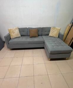 This is a three-seater corner sofa from IKEA in gray, featuring upholstered seat cushions and light-colored pointed wooden legs. - Image 9