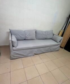 This IKEA HYLTARP three-seater sofa in Gransel grey features a sleek, minimalist cover design with matching soft back cushions and supportive arm cushions. - Image 2