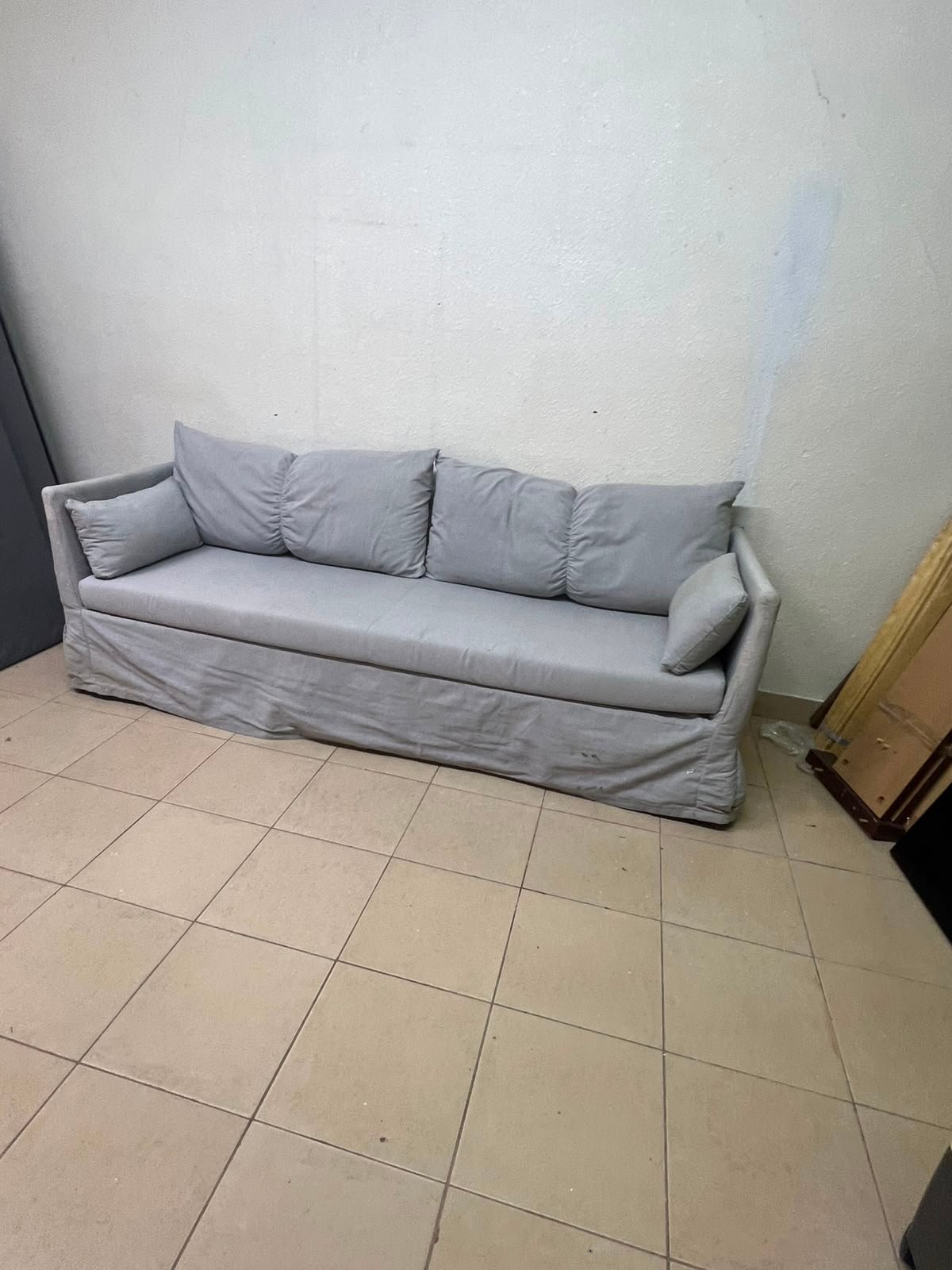 This IKEA HYLTARP three-seater sofa in Gransel grey features a sleek, minimalist cover design with matching soft back cushions and supportive arm cushions.