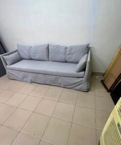 This IKEA HYLTARP three-seater sofa in Gransel grey features a sleek, minimalist cover design with matching soft back cushions and supportive arm cushions. - Image 6