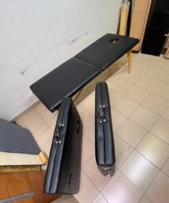 Portable and foldable massage tables made of black leather with a wooden frame and height-adjustable legs. - Image 4