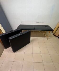 Portable and foldable massage tables made of black leather with a wooden frame and height-adjustable legs. - Image 7