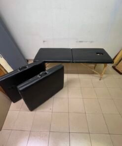 Portable and foldable massage tables made of black leather with a wooden frame and height-adjustable legs. - Image 9