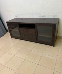 A television unit with a dark espresso-colored finish on solid mahogany wood and antique card catalog-style drawer pulls.