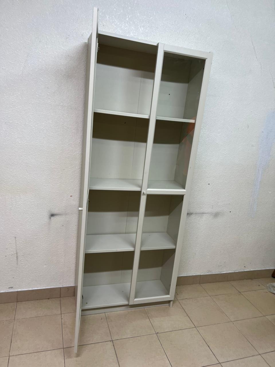 A bookcase with a glass door from IKEA, specifically from the BILLY/OXBERG series in white. - Image 2