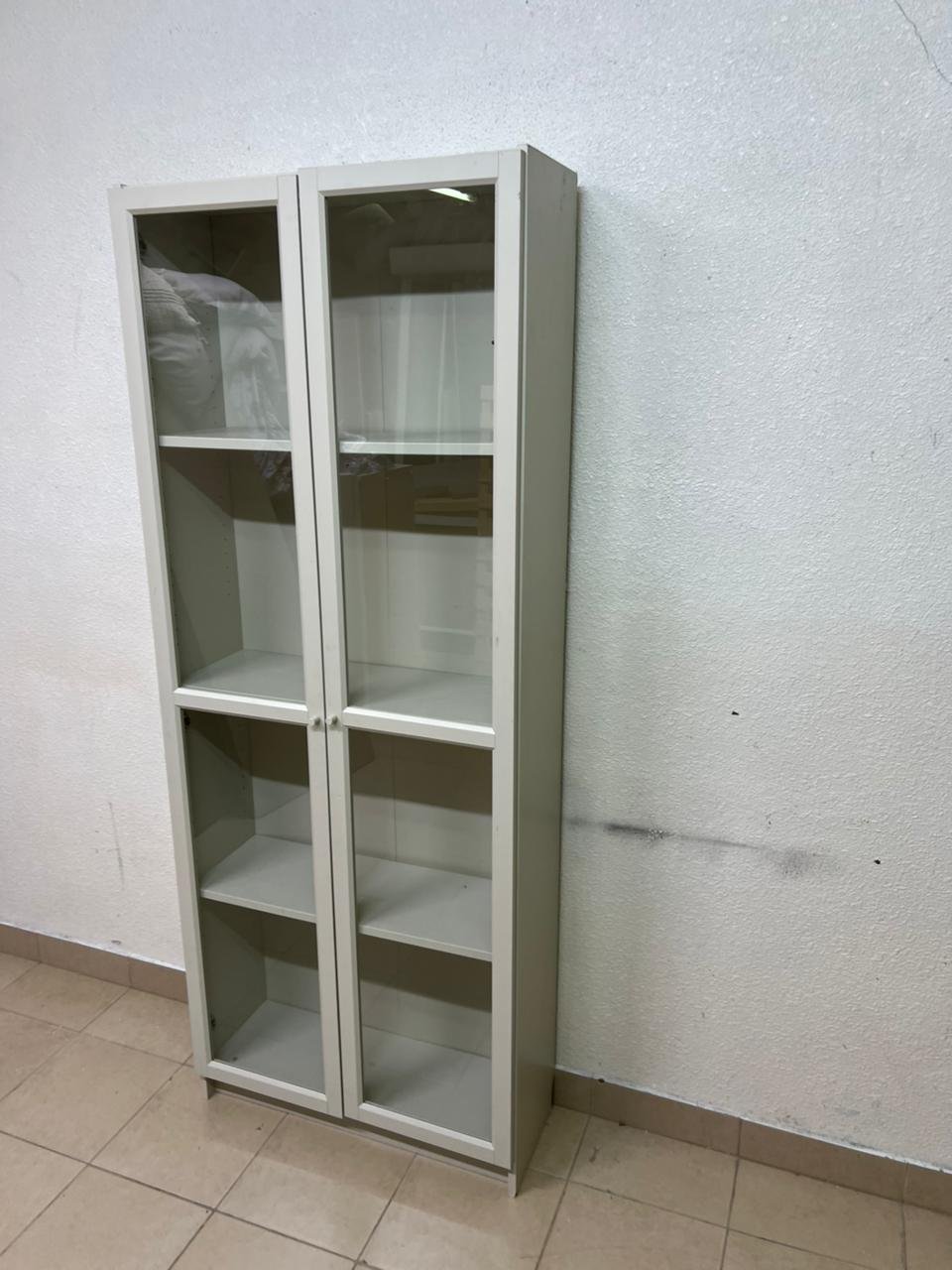 A bookcase with a glass door from IKEA, specifically from the BILLY/OXBERG series in white. - Image 3